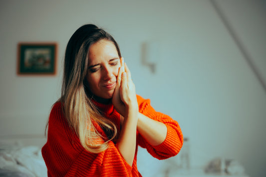 Woman experiencing severe jaw pain